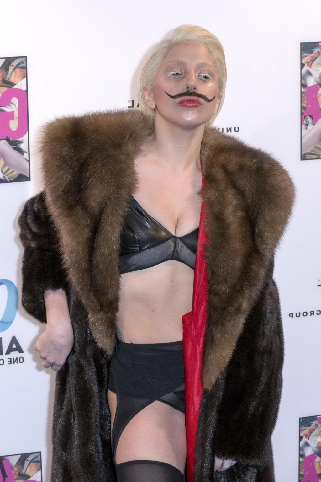 16P Lady Gaga wearing lingerie and fake moustache at her album promotion in Berlin