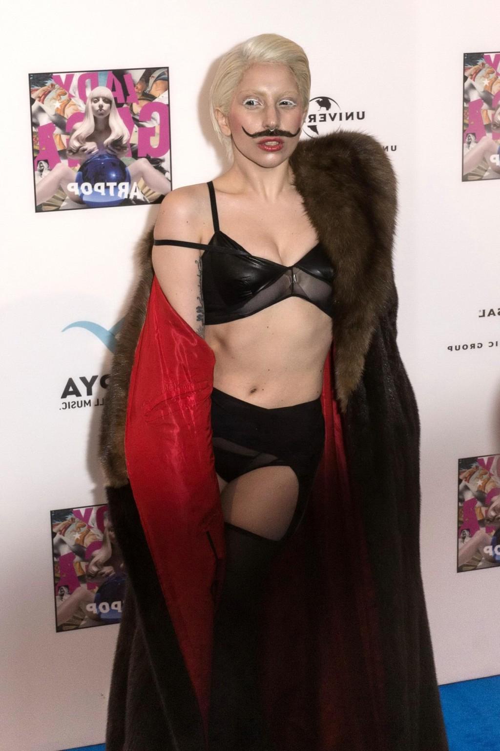 16P Lady Gaga wearing lingerie and fake moustache at her album promotion in Berlin