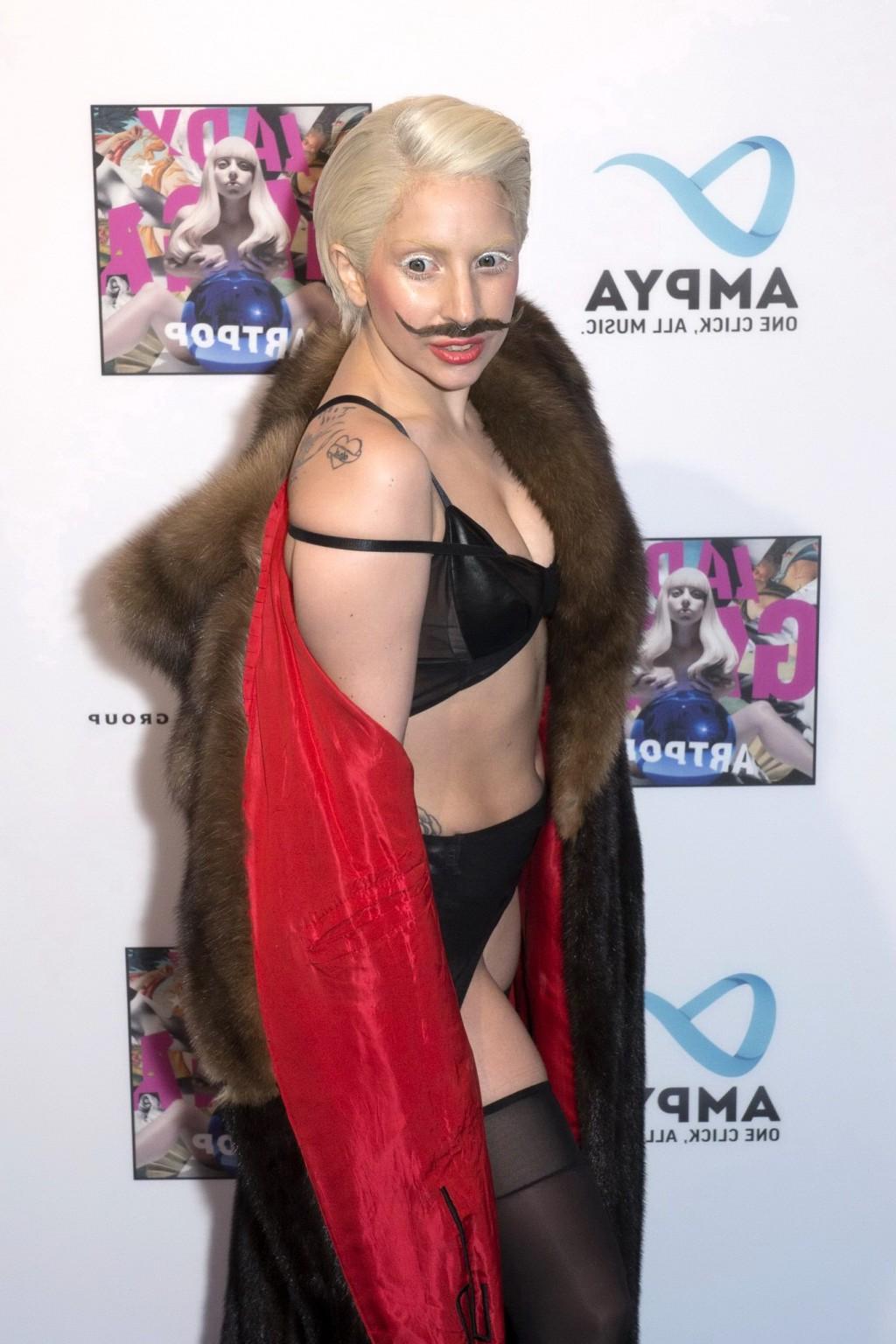 16P Lady Gaga wearing lingerie and fake moustache at her album promotion in Berlin