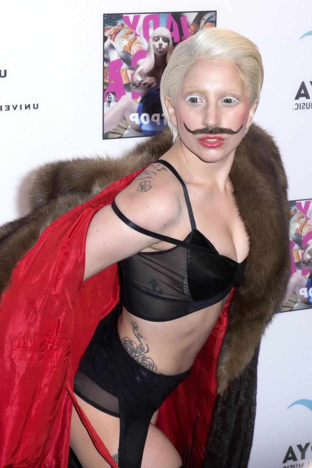 16P Lady Gaga wearing lingerie and fake moustache at her album promotion in Berlin