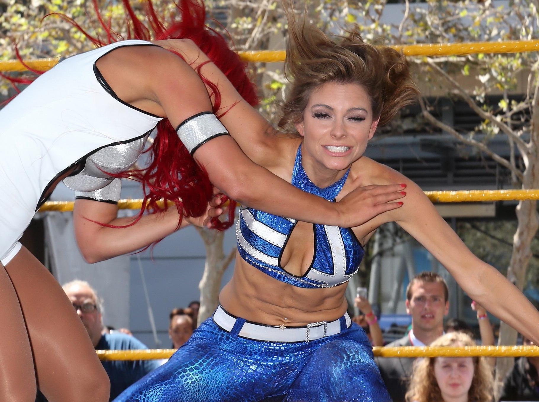 16P Maria Menounos wearing skimpy bikini top and leggings at Total Divas Take-Over o