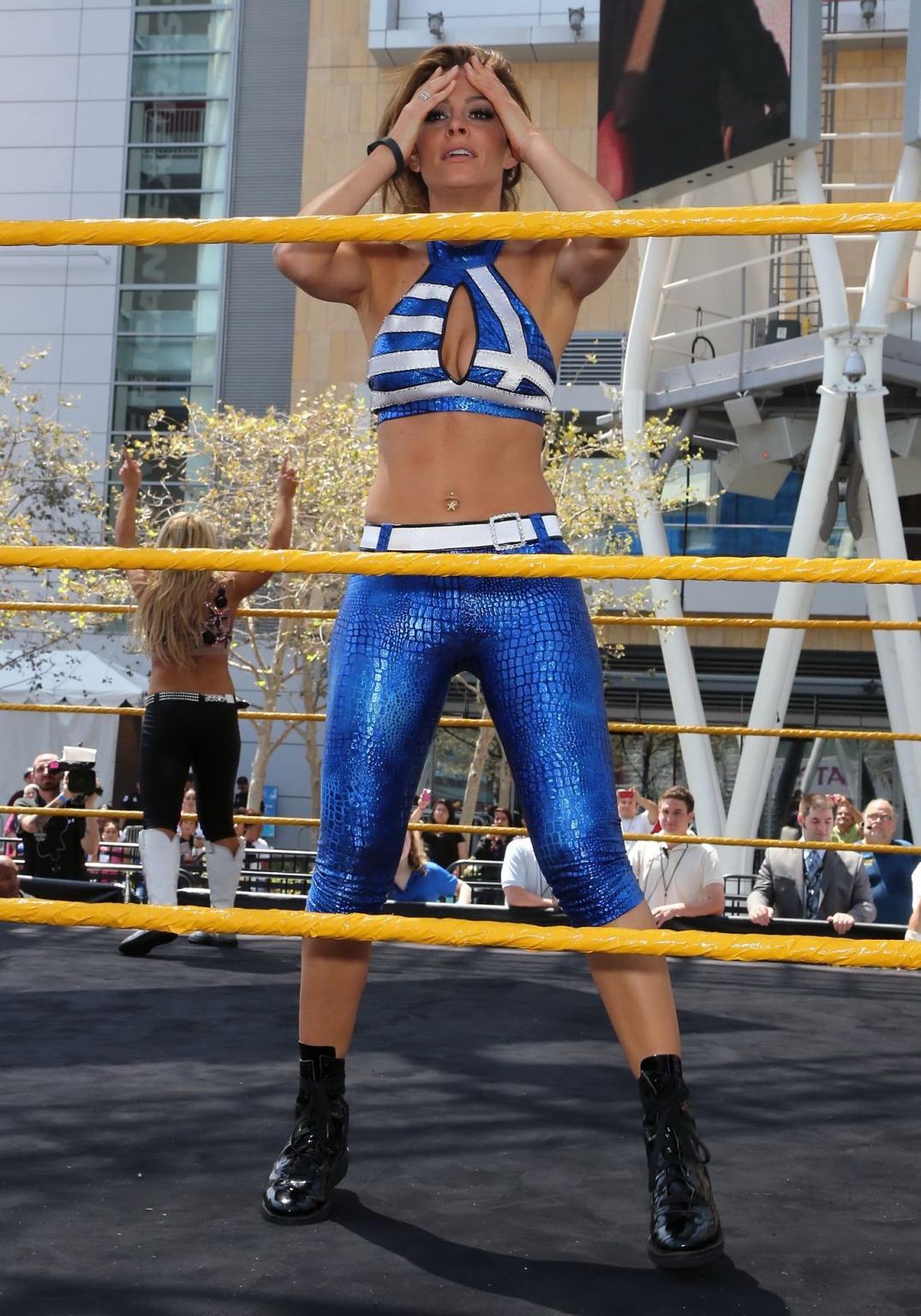 16P Maria Menounos wearing skimpy bikini top and leggings at Total Divas Take-Over o