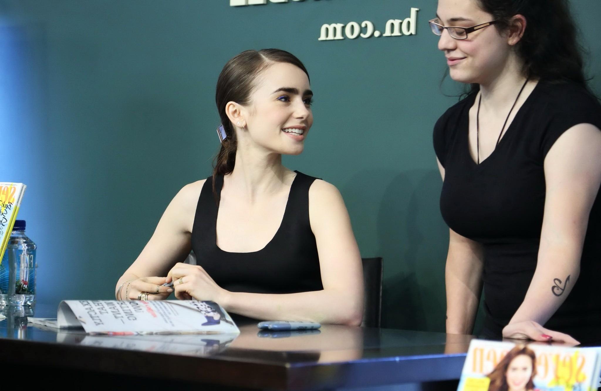16P Lily Collins looks hot wearing black belly top and leather skirt at Seventen Mag