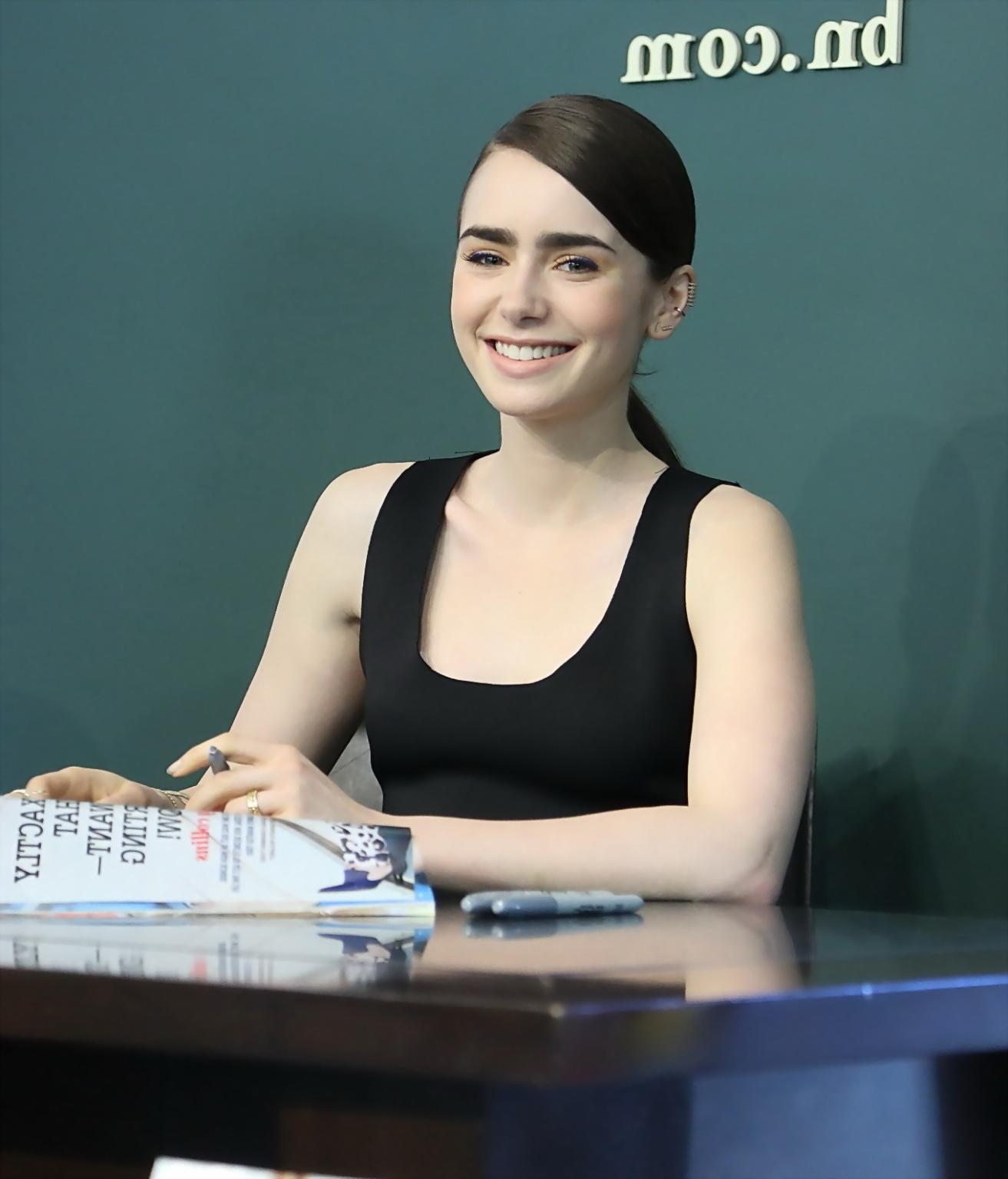 16P Lily Collins looks hot wearing black belly top and leather skirt at Seventen Mag