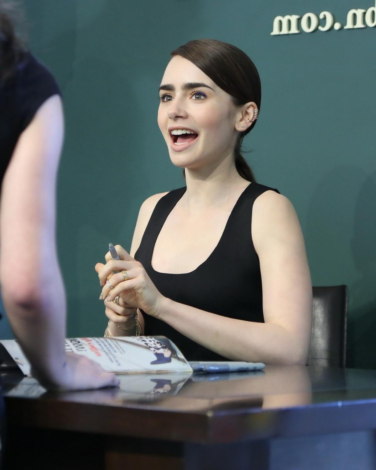 16P Lily Collins looks hot wearing black belly top and leather skirt at Seventen Mag