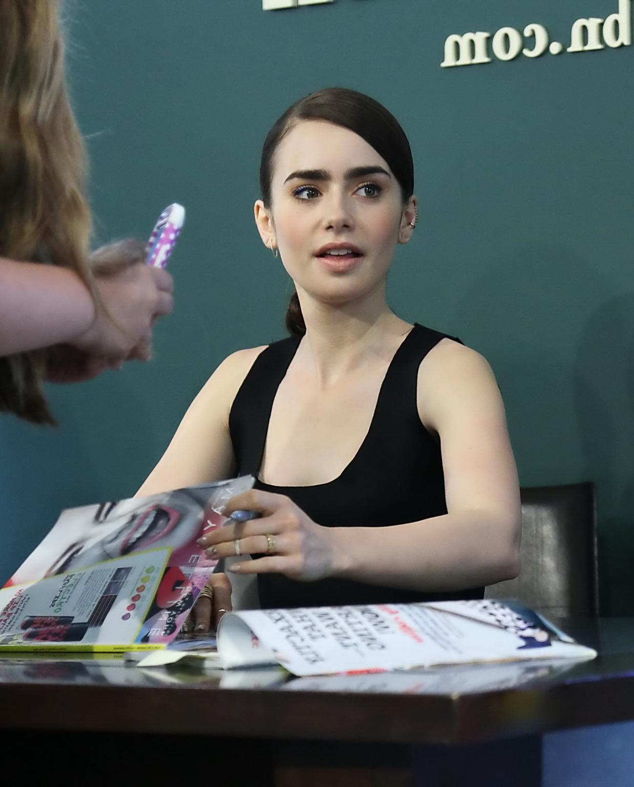 16P Lily Collins looks hot wearing black belly top and leather skirt at Seventen Mag