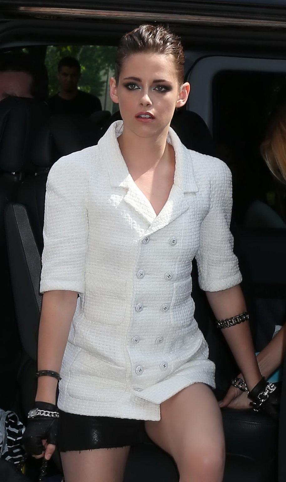 16P Kristen Stewart leggy wearing a black shorts at the Chanel fashion show in Paris