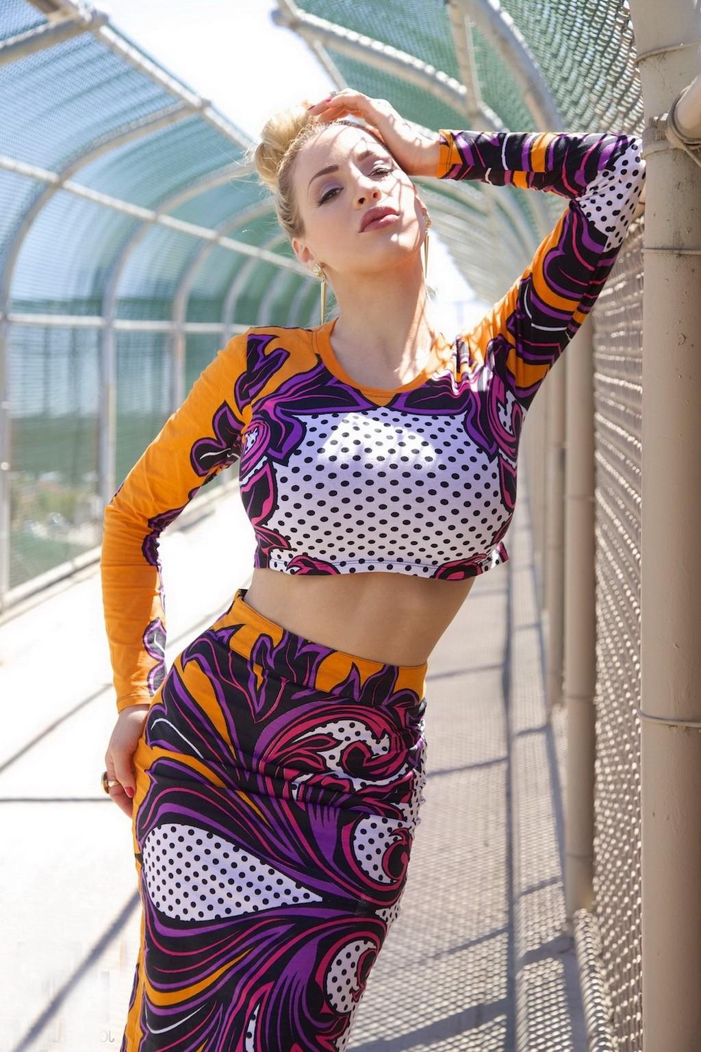15P Jordan Carver exposing her curvy body in a belly top and mini skirt at Bridge Bi