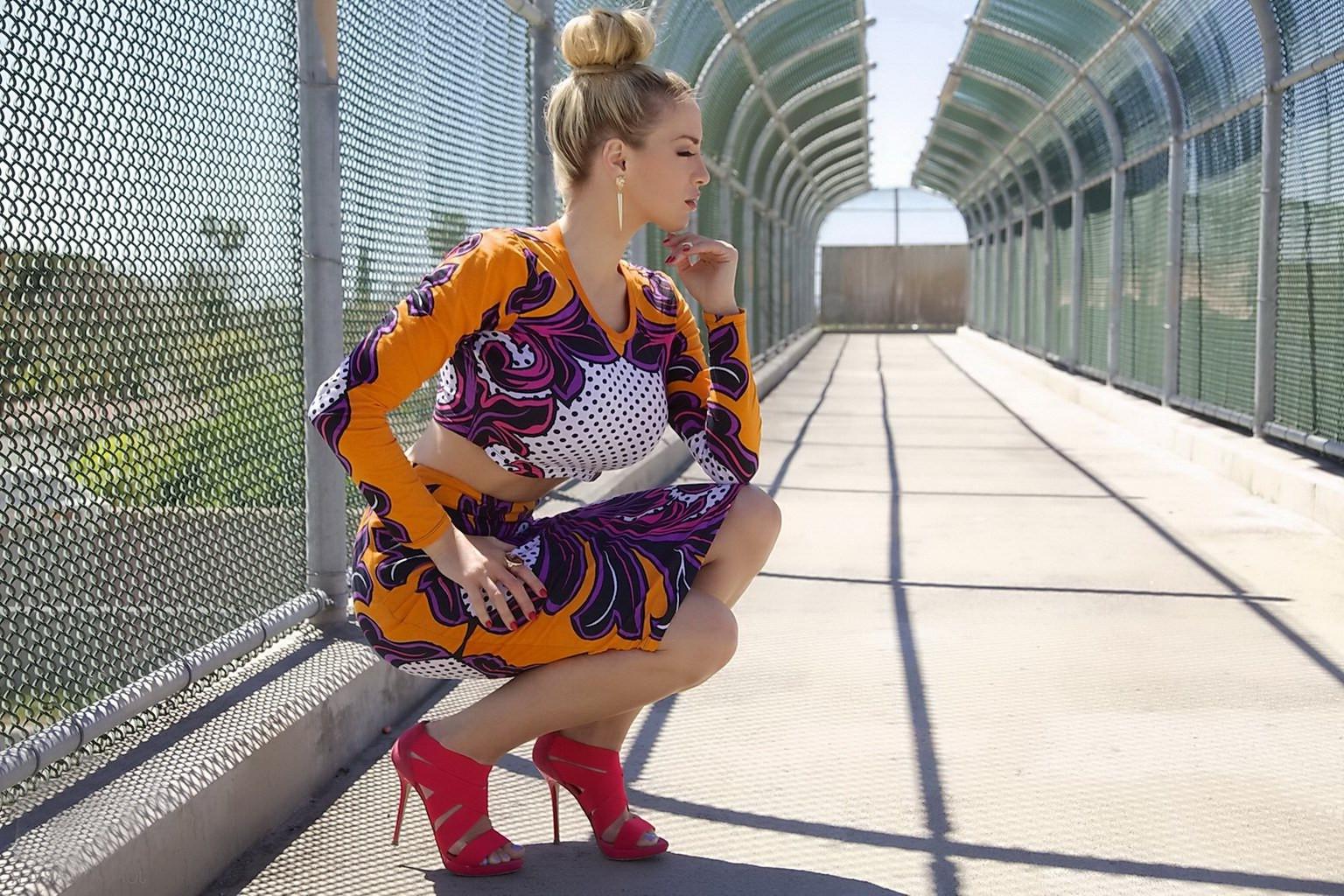 15P Jordan Carver exposing her curvy body in a belly top and mini skirt at Bridge Bi