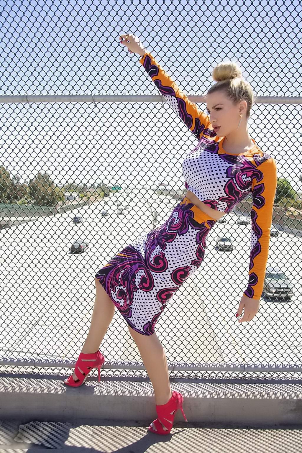 15P Jordan Carver exposing her curvy body in a belly top and mini skirt at Bridge Bi