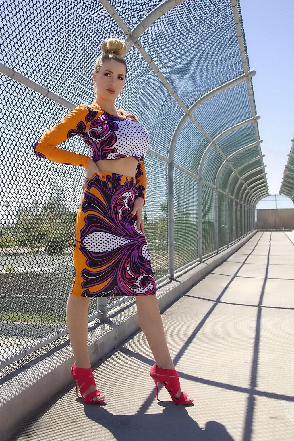 15P Jordan Carver exposing her curvy body in a belly top and mini skirt at Bridge Bi