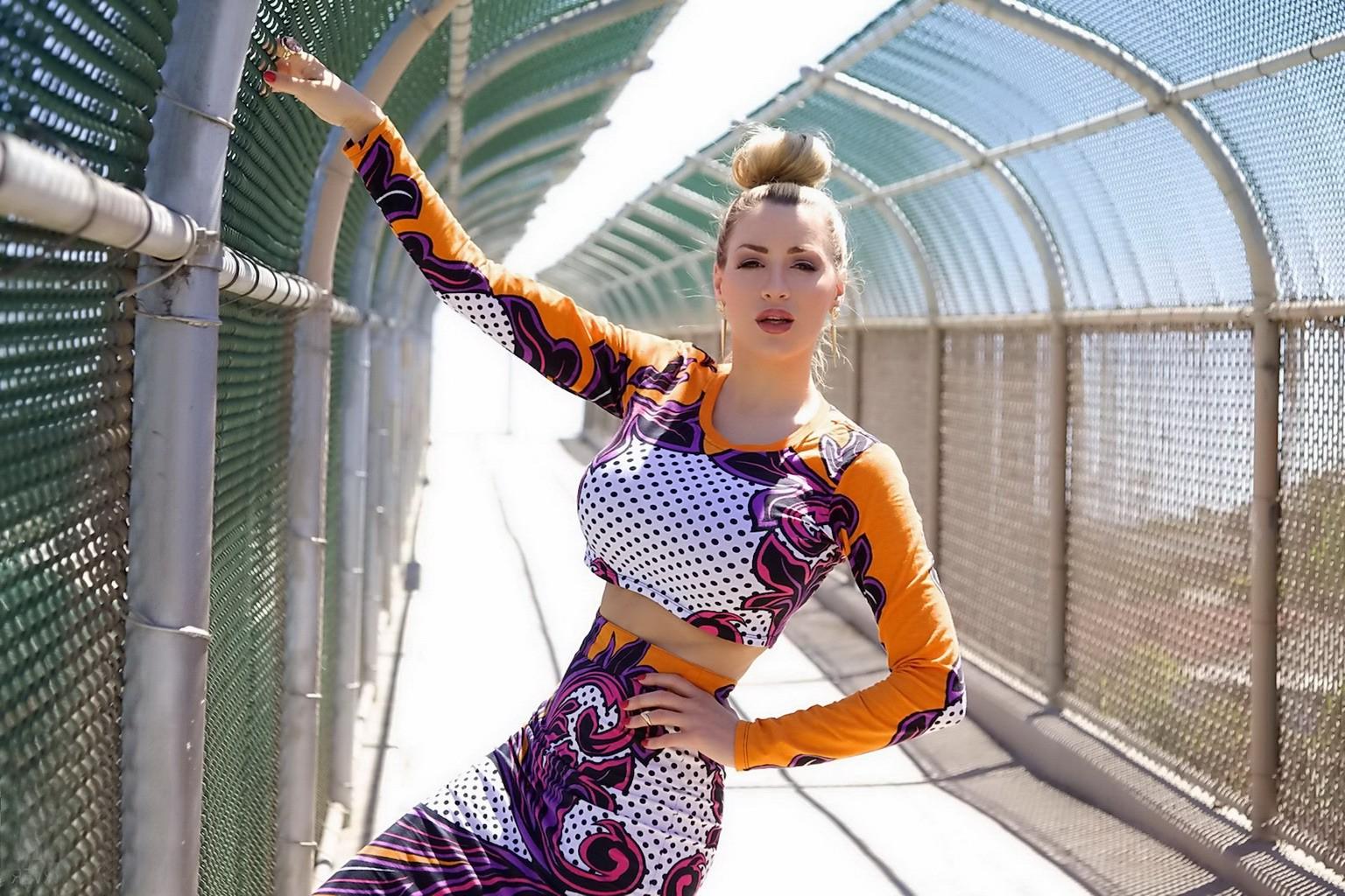 15P Jordan Carver exposing her curvy body in a belly top and mini skirt at Bridge Bi
