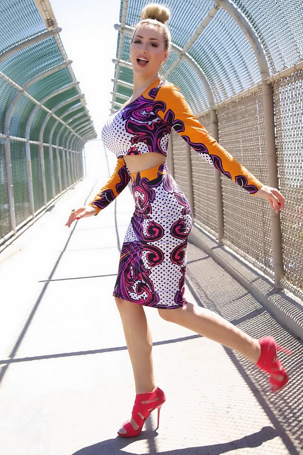 15P Jordan Carver exposing her curvy body in a belly top and mini skirt at Bridge Bi