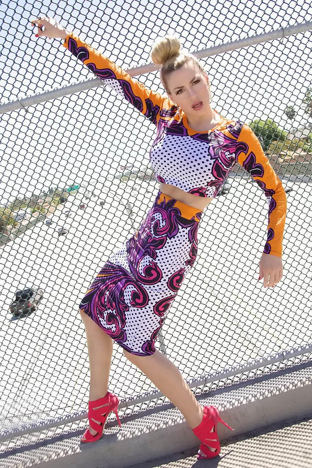 15P Jordan Carver exposing her curvy body in a belly top and mini skirt at Bridge Bi