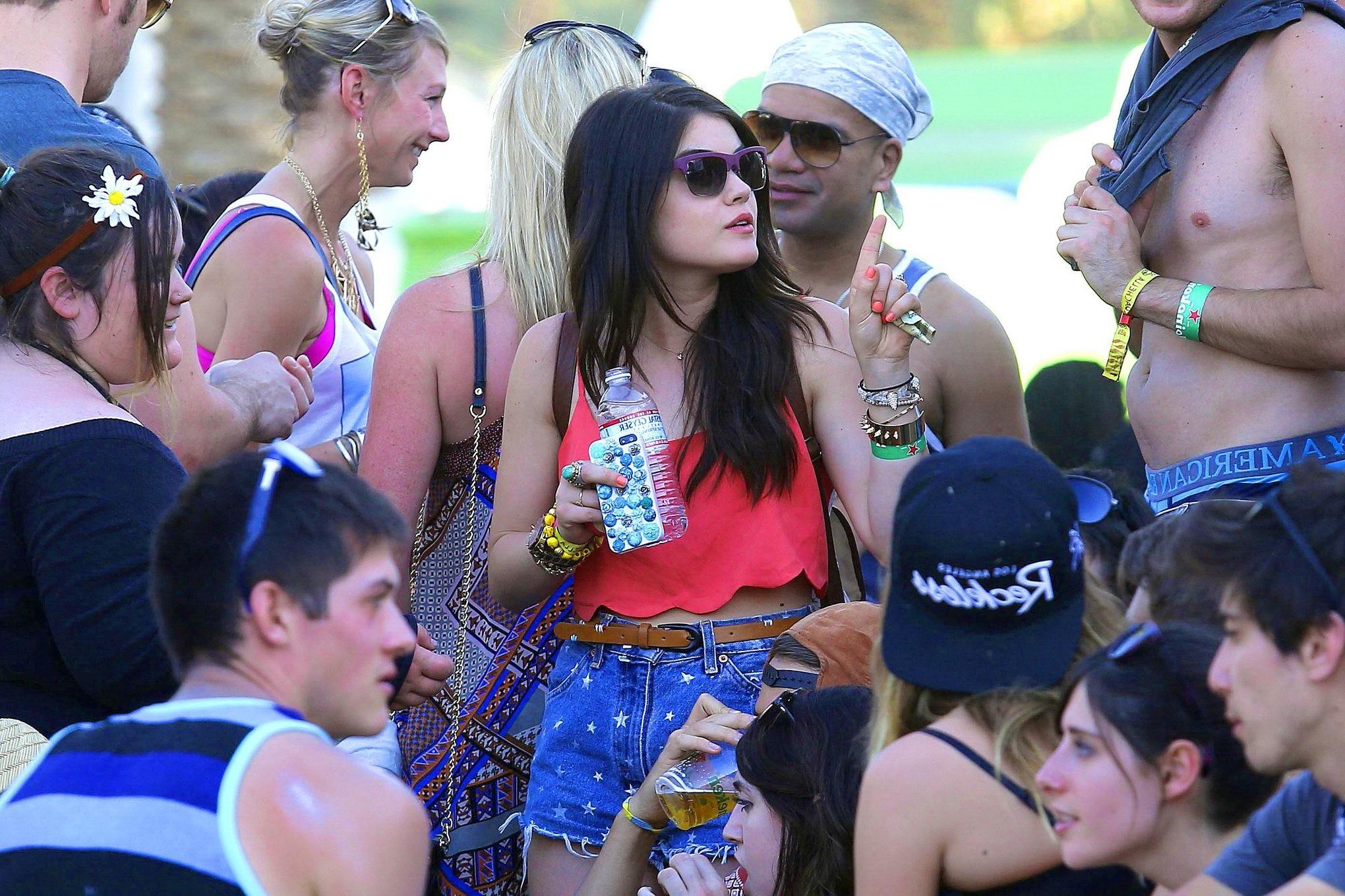 16P Lucy Hale wearing tiny red belly top and denim shorts at 2013 Coachella Music an