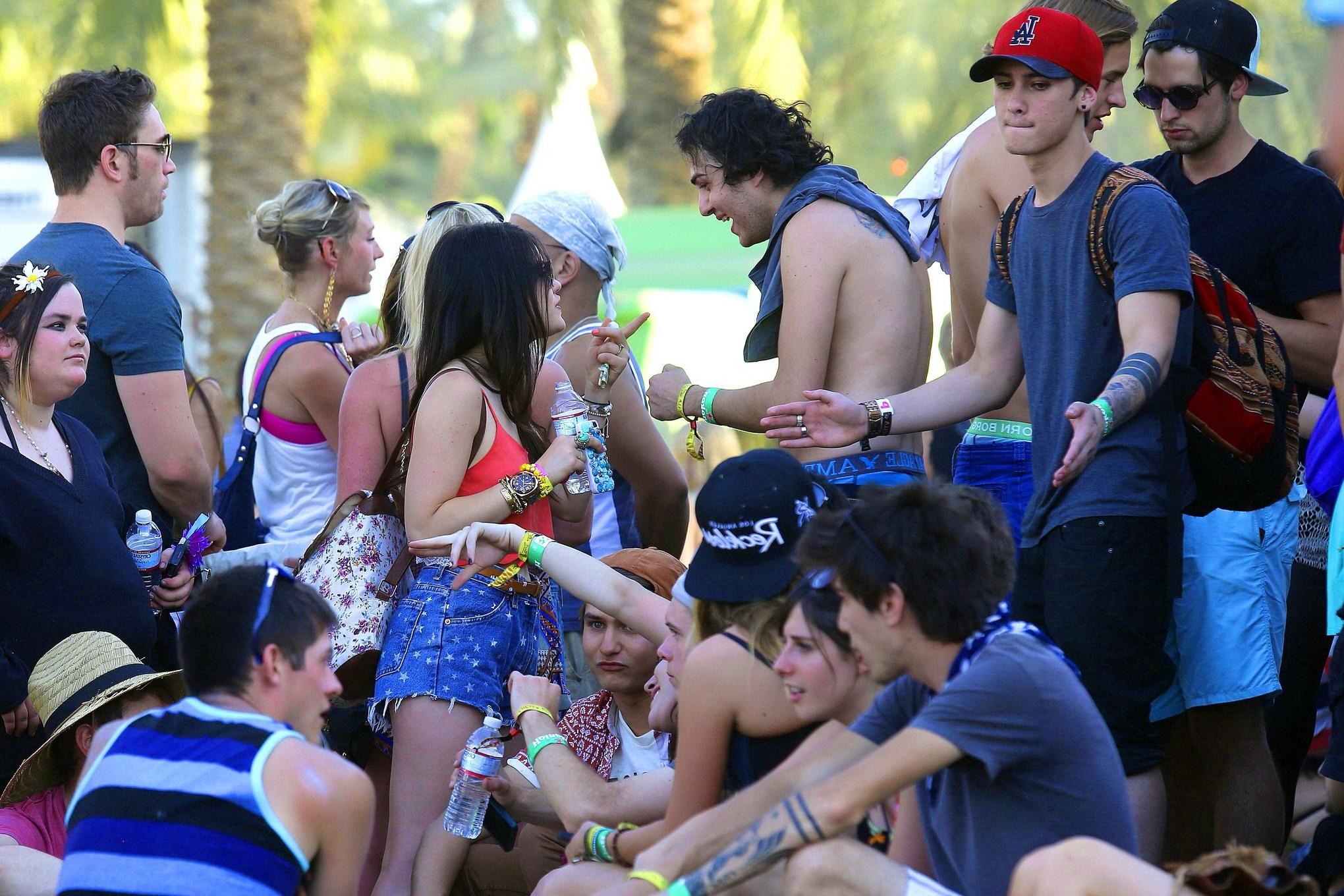 16P Lucy Hale wearing tiny red belly top and denim shorts at 2013 Coachella Music an