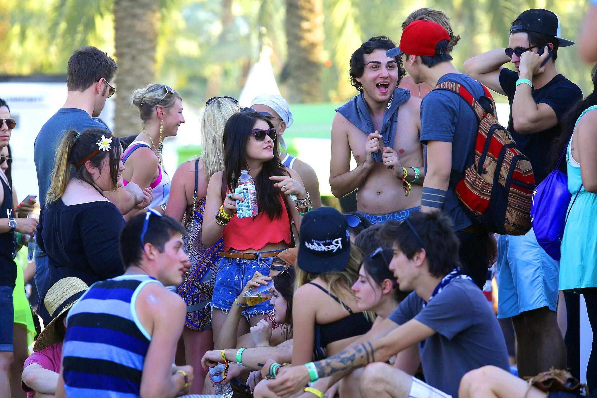 16P Lucy Hale wearing tiny red belly top and denim shorts at 2013 Coachella Music an