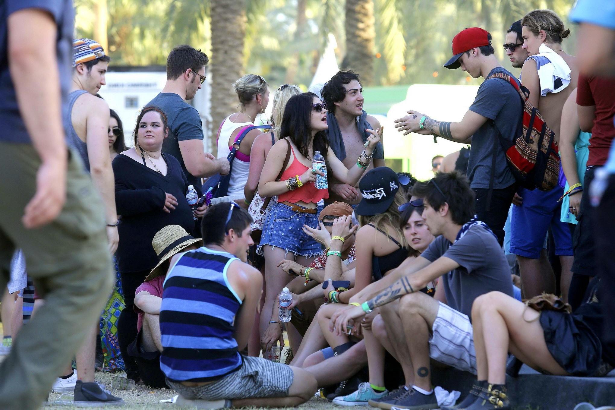 16P Lucy Hale wearing tiny red belly top and denim shorts at 2013 Coachella Music an