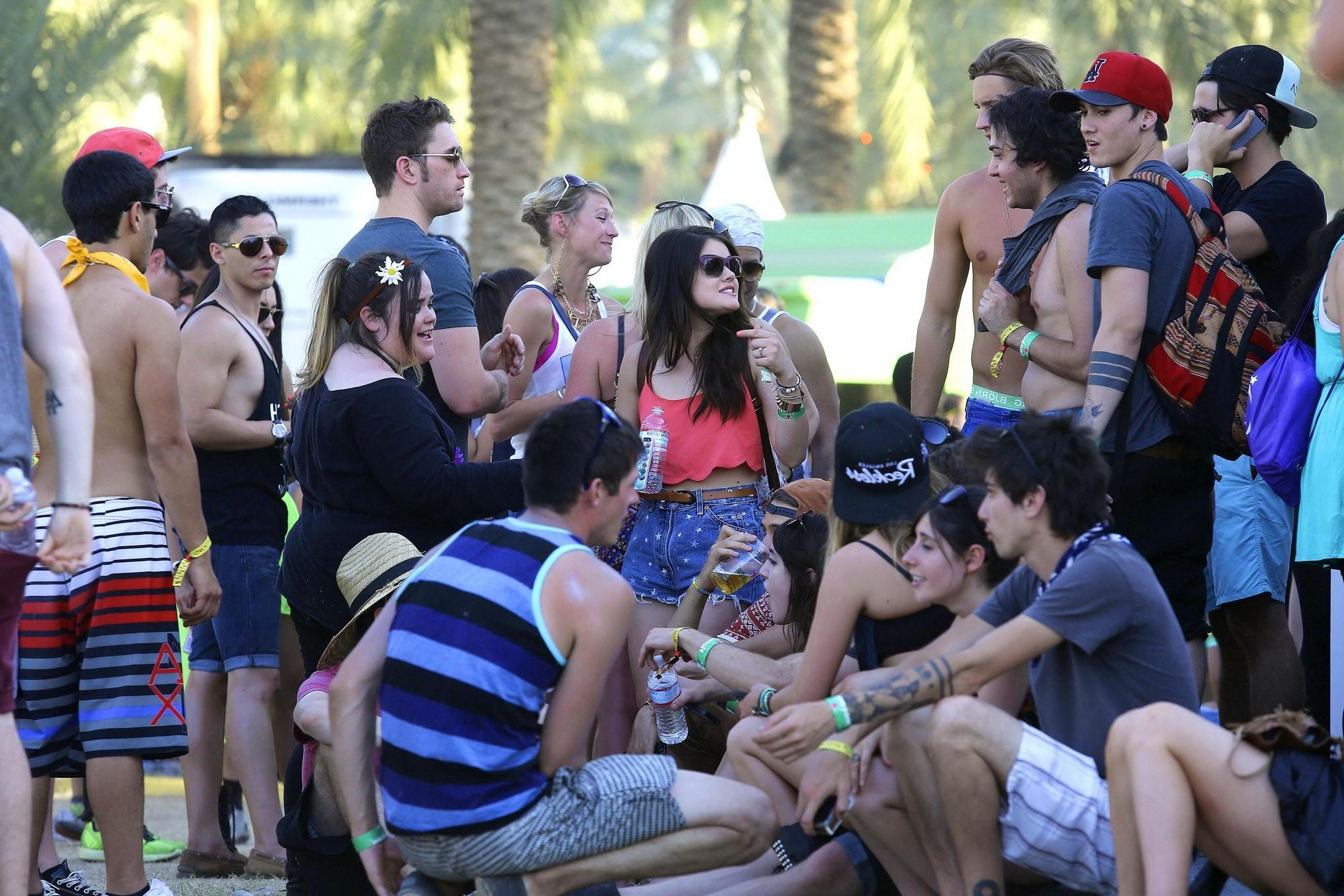 16P Lucy Hale wearing tiny red belly top and denim shorts at 2013 Coachella Music an