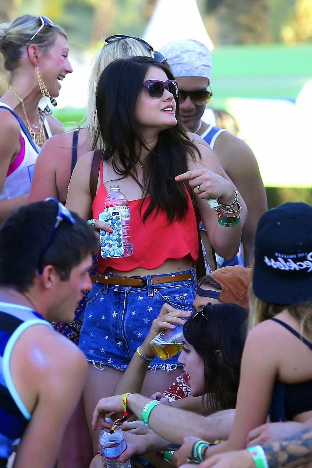 16P Lucy Hale wearing tiny red belly top and denim shorts at 2013 Coachella Music an