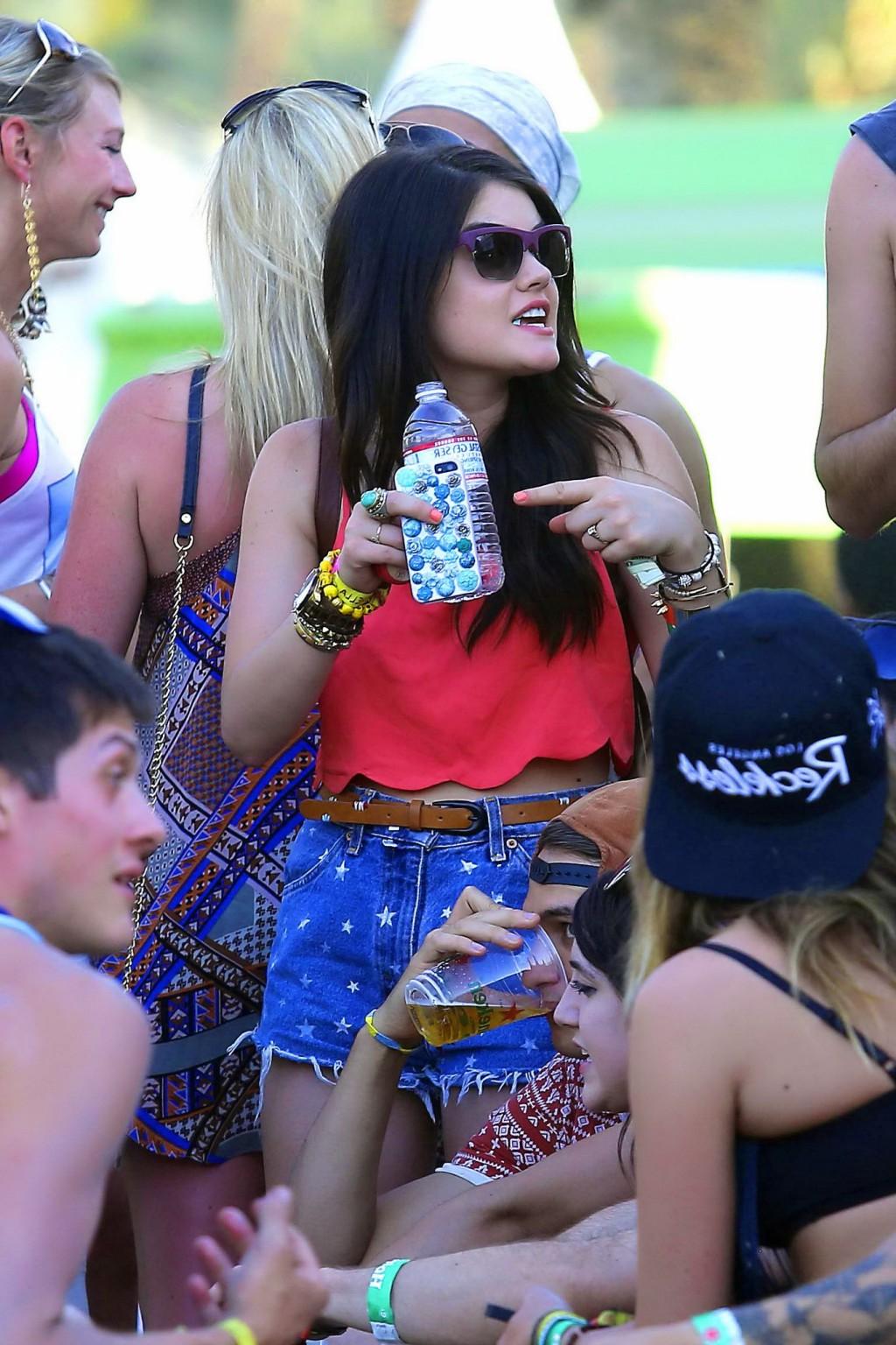 16P Lucy Hale wearing tiny red belly top and denim shorts at 2013 Coachella Music an