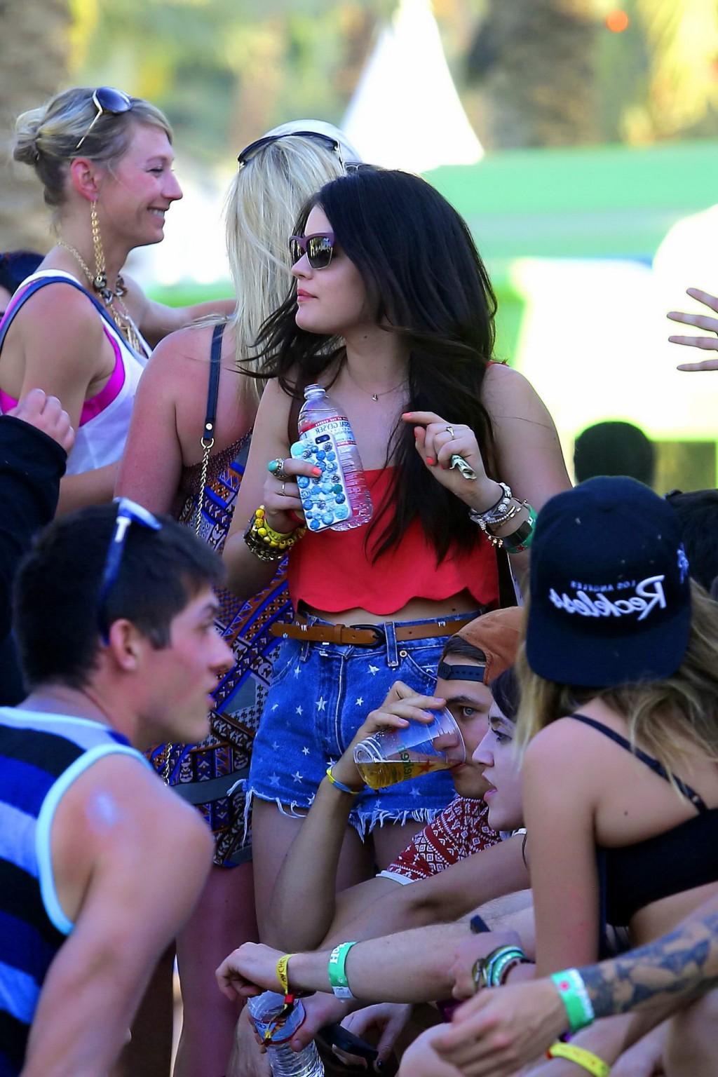 16P Lucy Hale wearing tiny red belly top and denim shorts at 2013 Coachella Music an