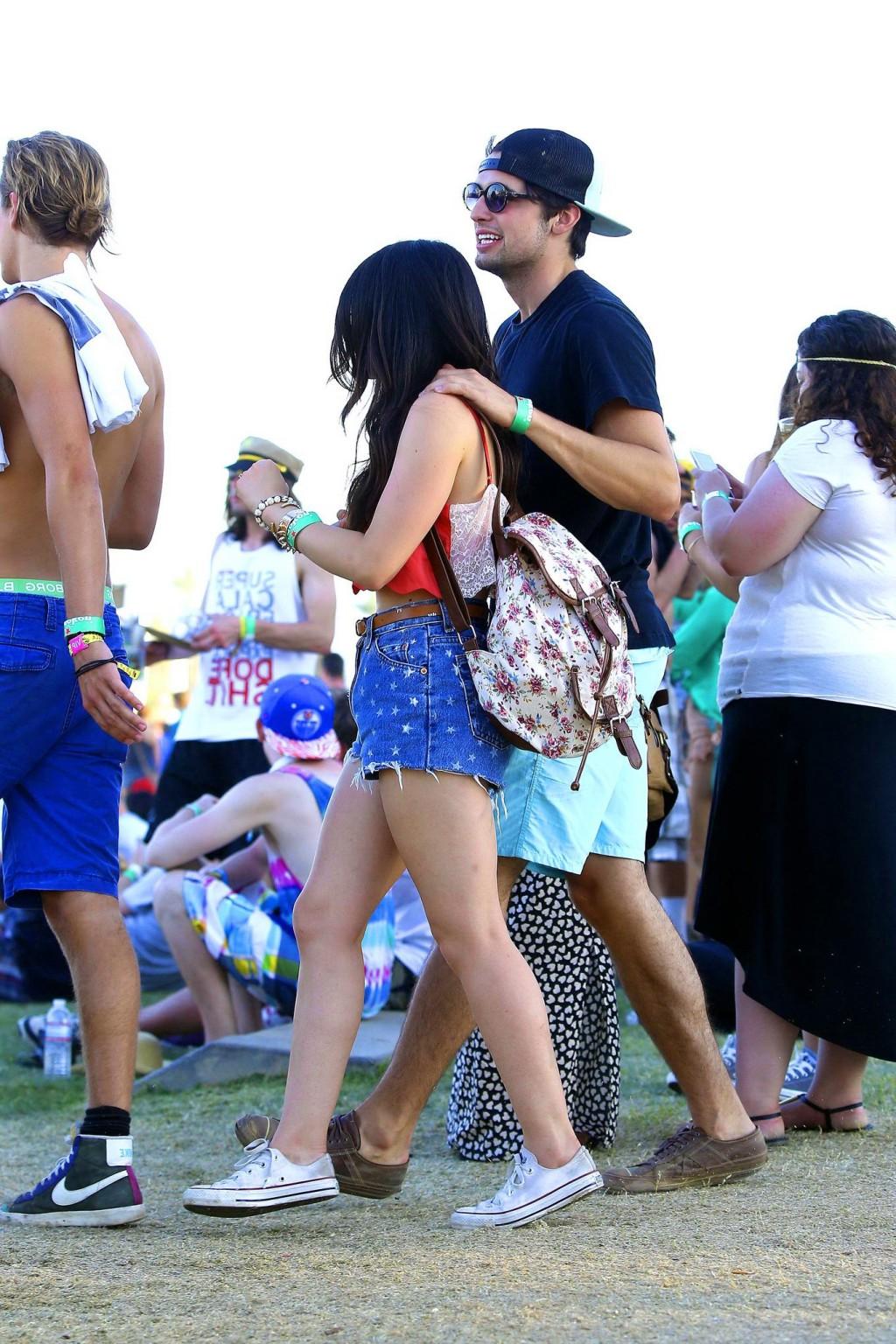 16P Lucy Hale wearing tiny red belly top and denim shorts at 2013 Coachella Music an