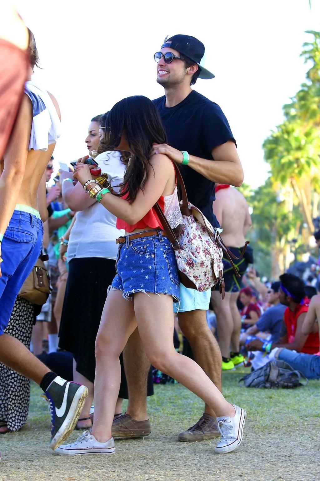 16P Lucy Hale wearing tiny red belly top and denim shorts at 2013 Coachella Music an