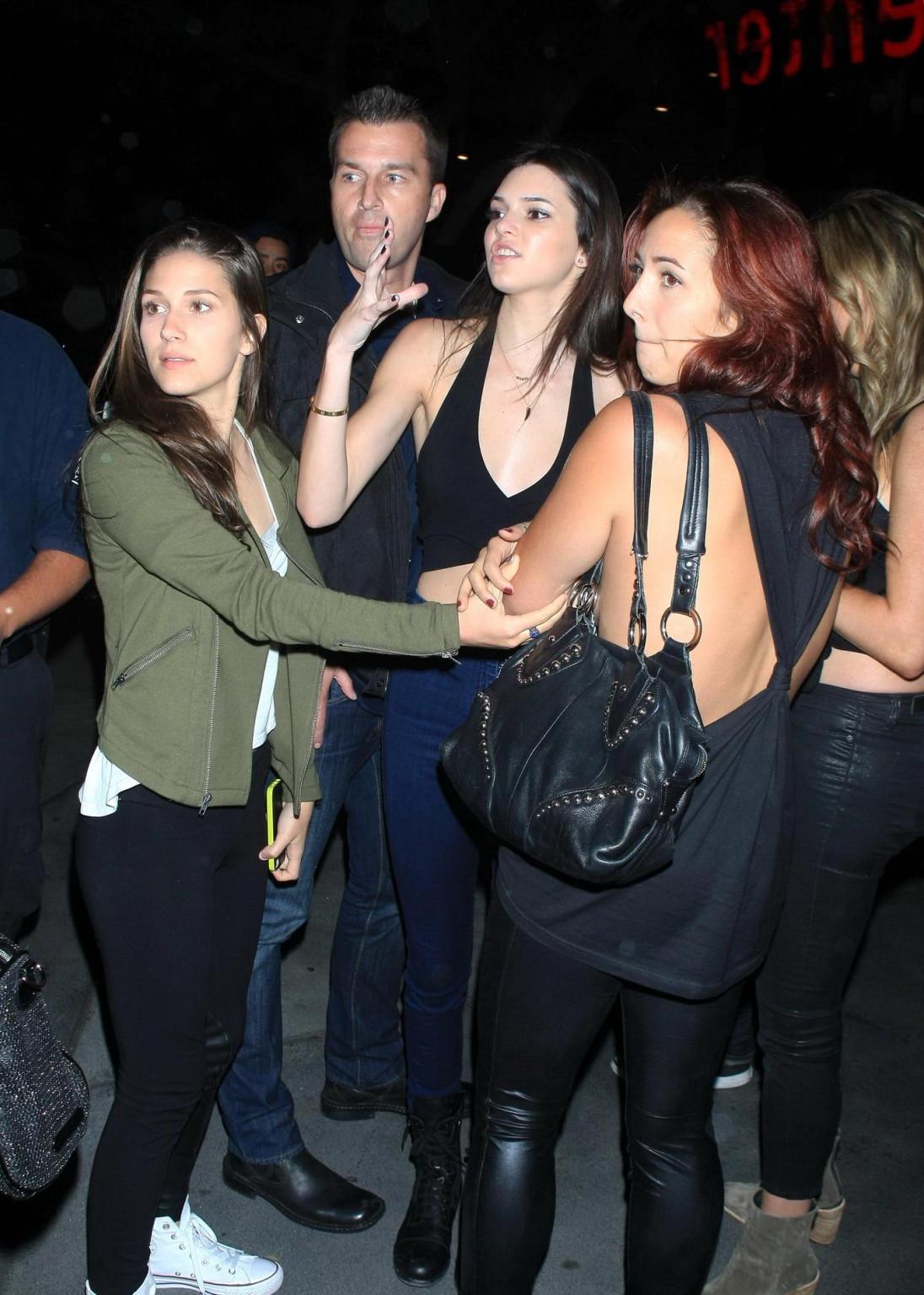 16P Kendall Jenner in black belly top  jeans leavin a Rihanna concert