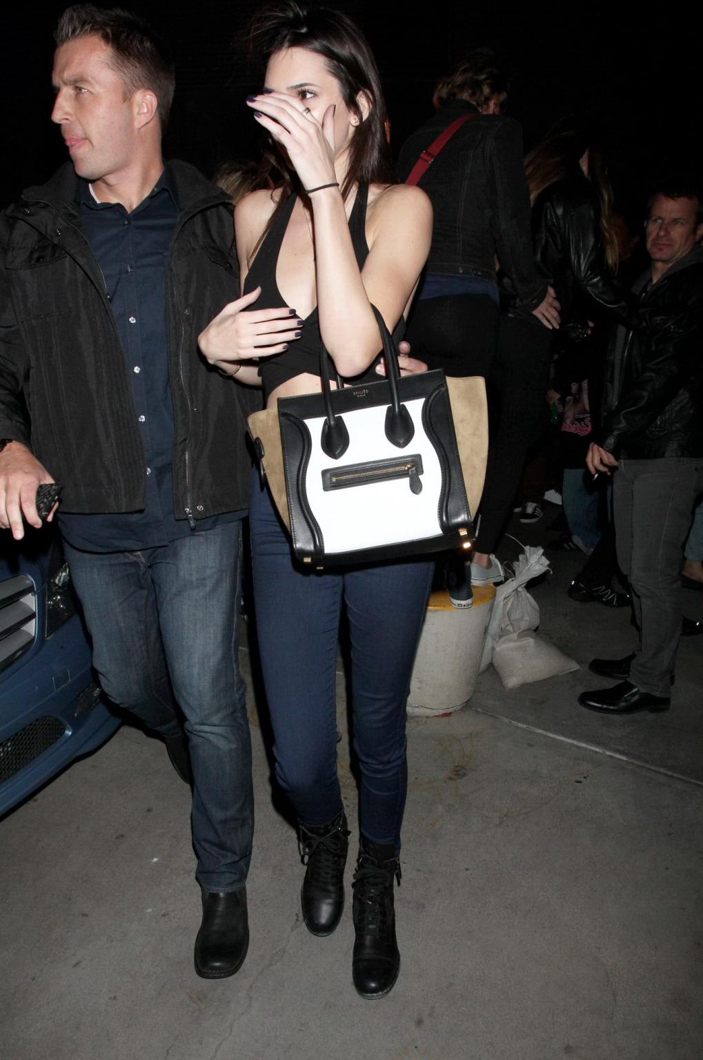 16P Kendall Jenner in black belly top  jeans leavin a Rihanna concert
