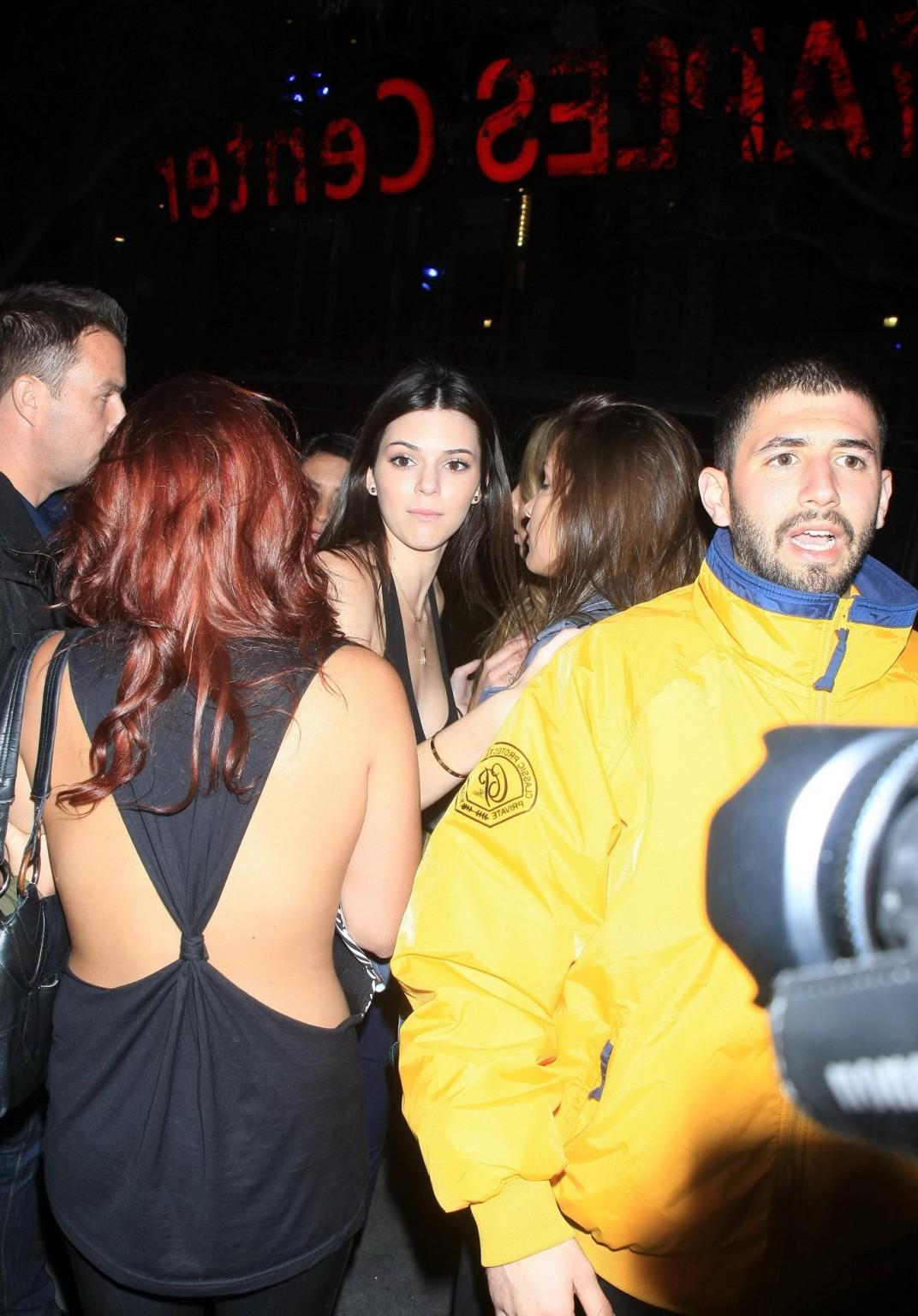 16P Kendall Jenner in black belly top  jeans leavin a Rihanna concert