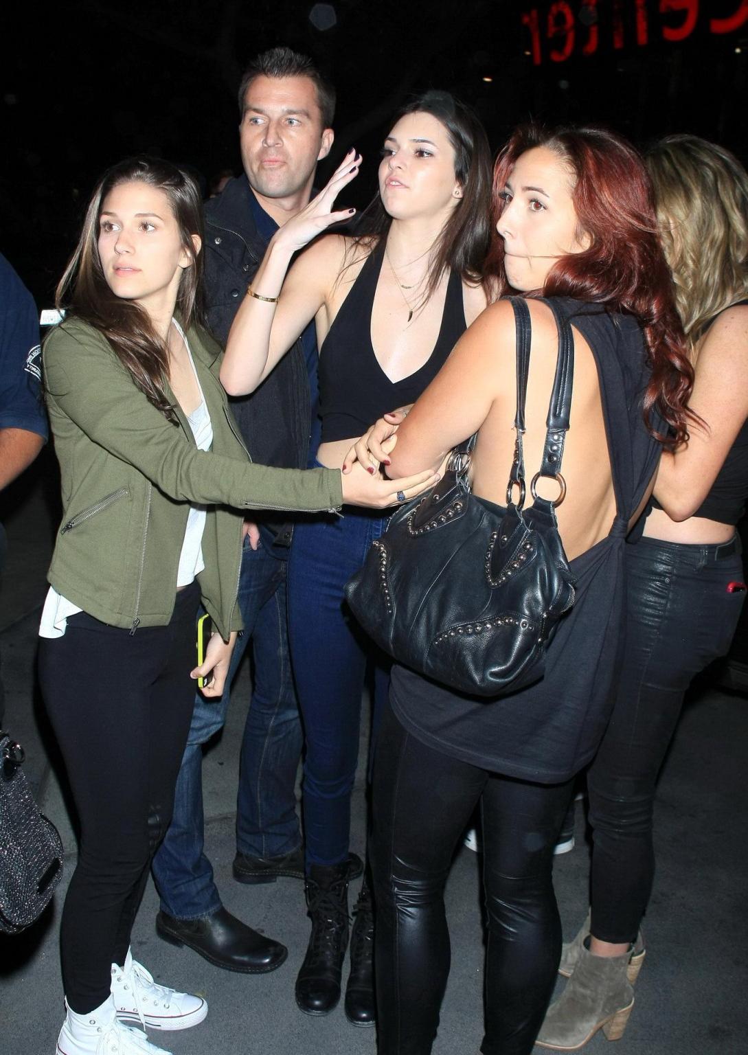 16P Kendall Jenner in black belly top  jeans leavin a Rihanna concert
