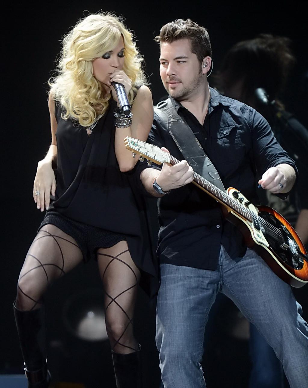 16P Carrie Underwood performing in skimpy black outfit at Country To Country Music F