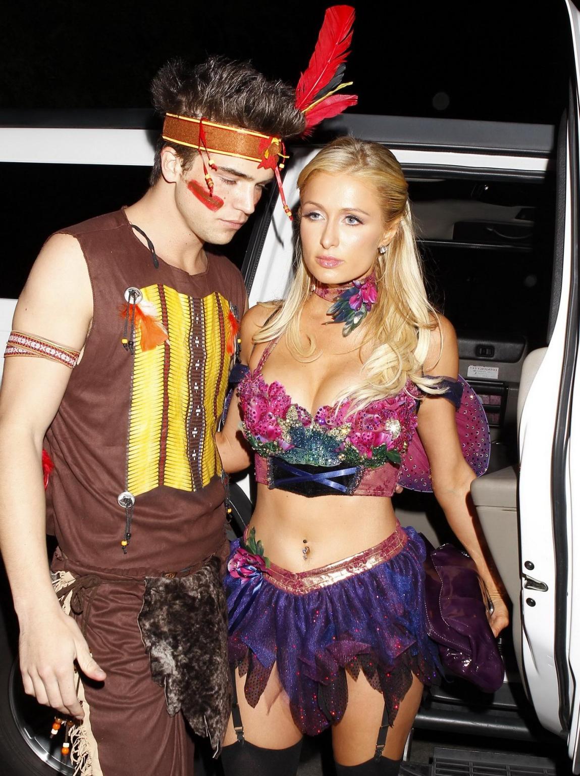 10P Paris Hilton wearing a belly top  stockings at the Halloween party in LA