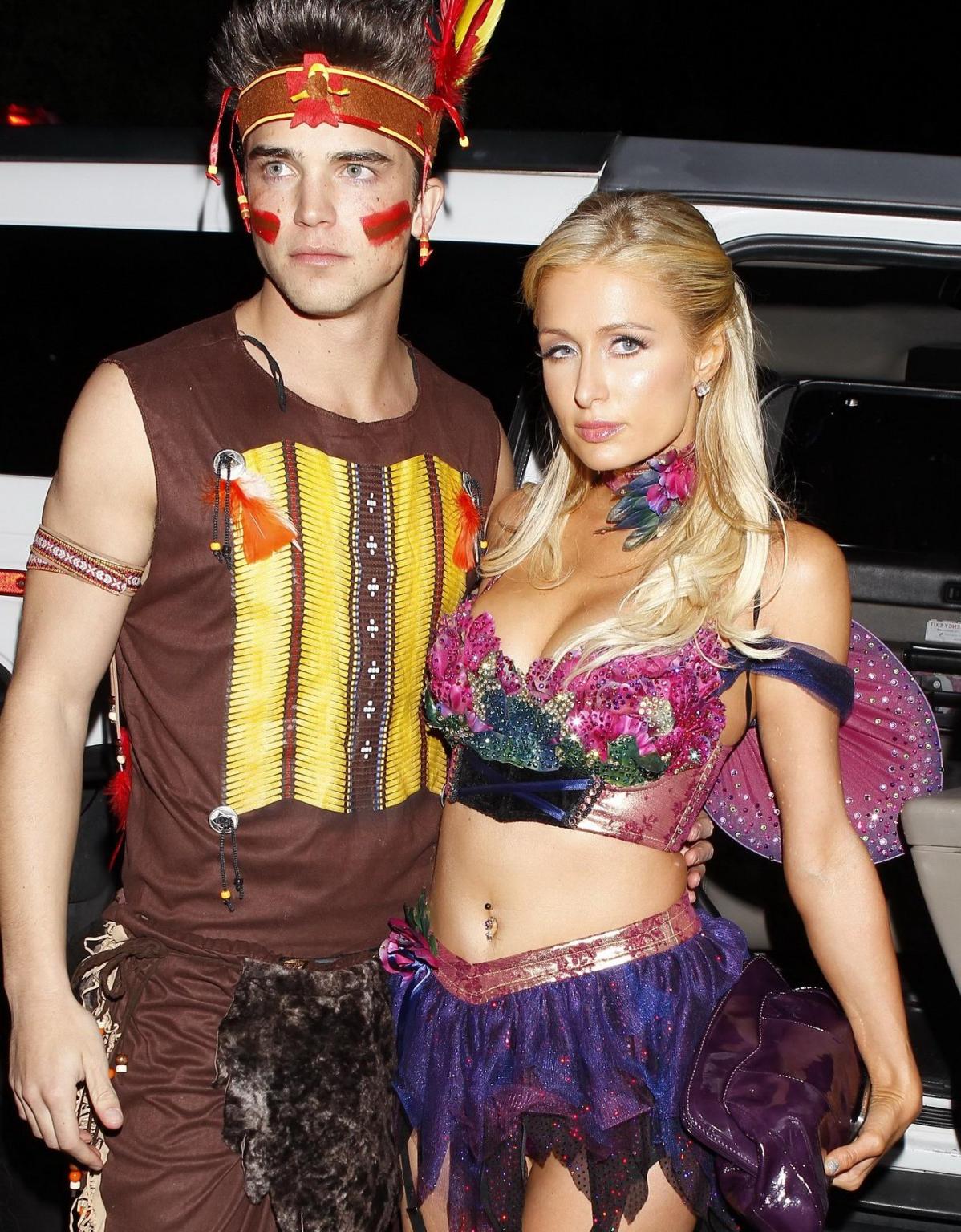 10P Paris Hilton wearing a belly top  stockings at the Halloween party in LA