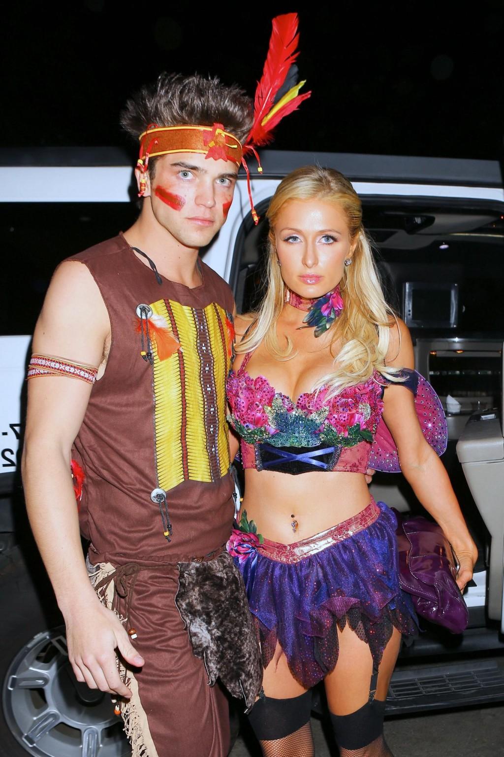 10P Paris Hilton wearing a belly top  stockings at the Halloween party in LA