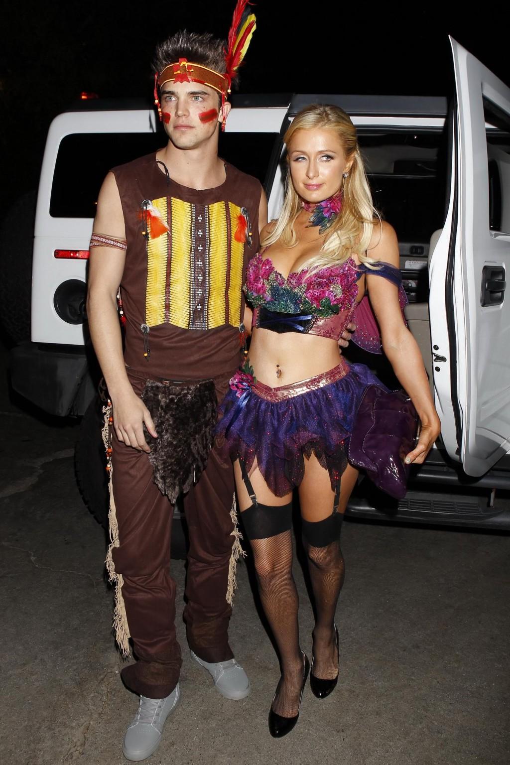 10P Paris Hilton wearing a belly top  stockings at the Halloween party in LA