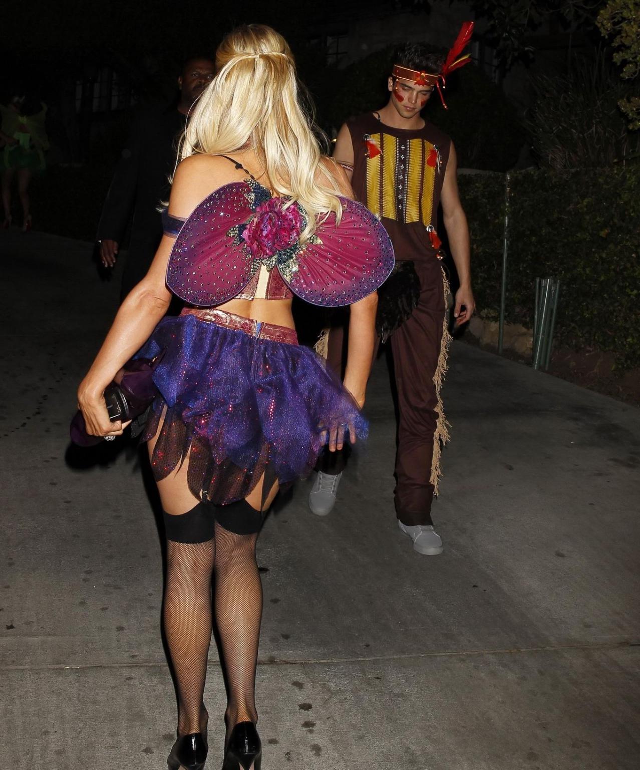 10P Paris Hilton wearing a belly top  stockings at the Halloween party in LA