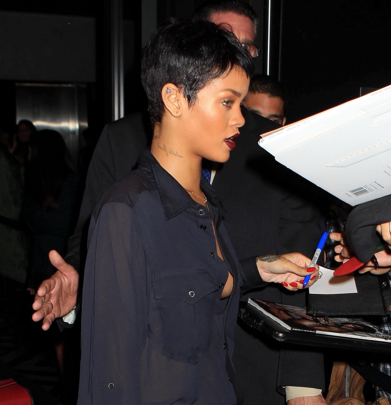 10P Rihanna braless in wide open shirt leaving her hotel in NYC