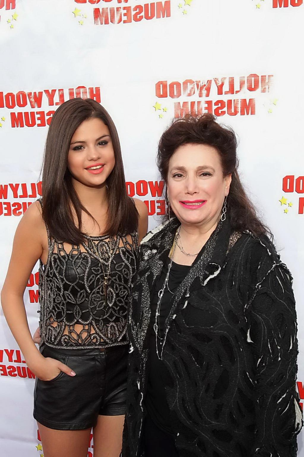 10P Selena Gomez stunning in leather shorts and belly top at the Marilyn Monroe Exhi