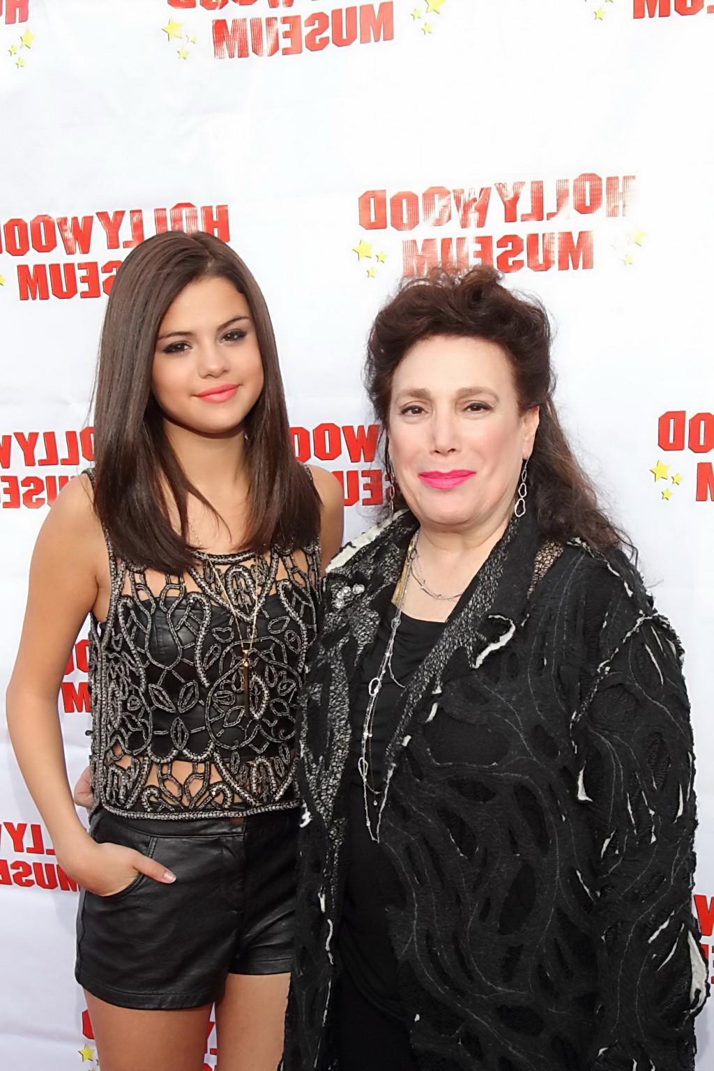 10P Selena Gomez stunning in leather shorts and belly top at the Marilyn Monroe Exhi