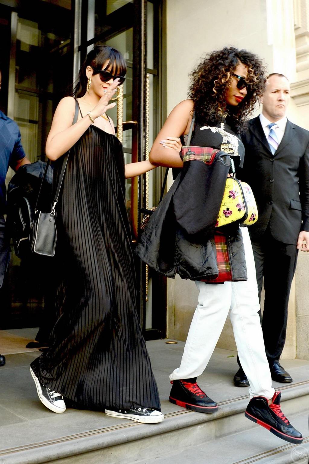 10P Rihanna braless in see through top leaving her hotel in London