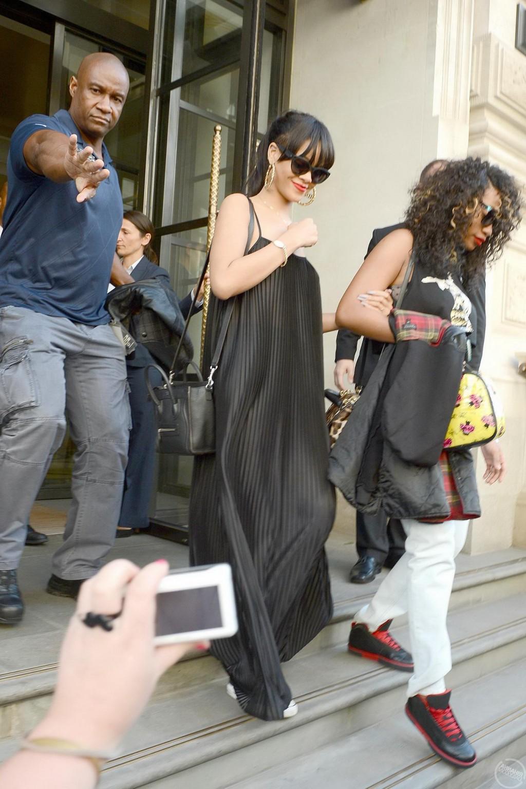 10P Rihanna braless in see through top leaving her hotel in London