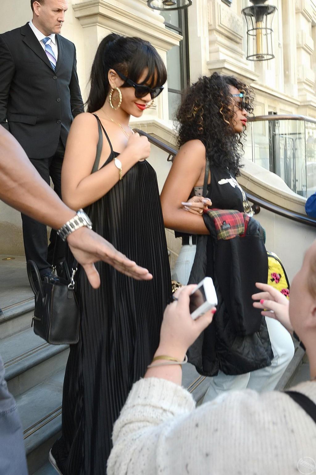 10P Rihanna braless in see through top leaving her hotel in London