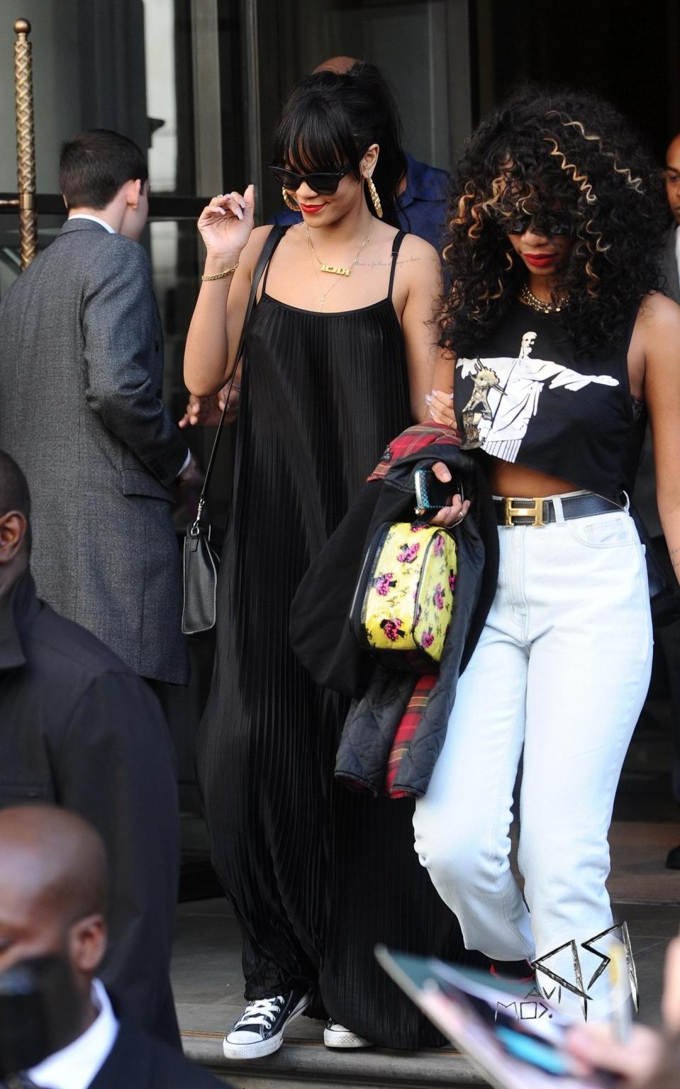10P Rihanna braless in see through top leaving her hotel in London