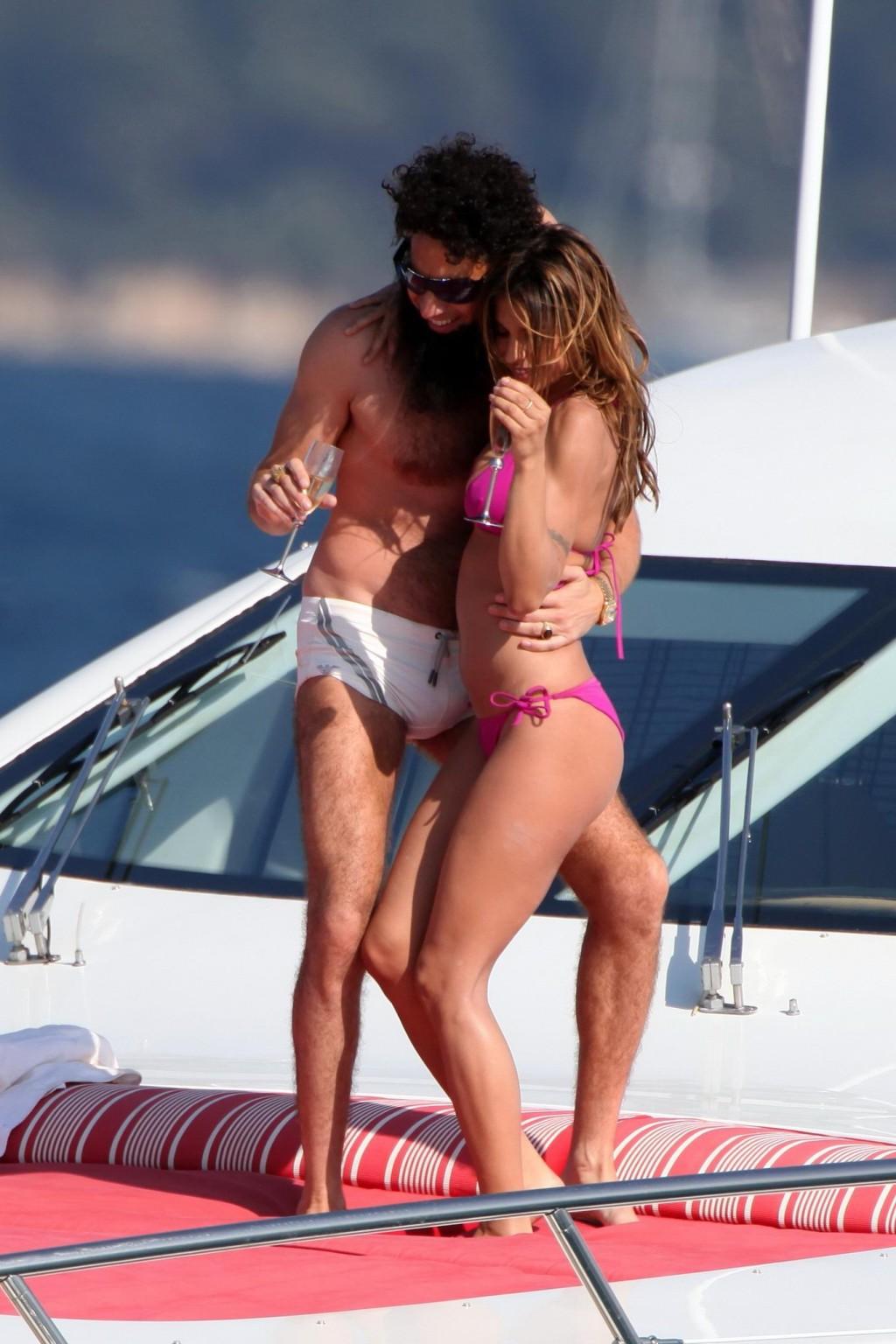 10P Elisabetta Canalis in bikini jerking her boyfriend's cock over his shorts on a y