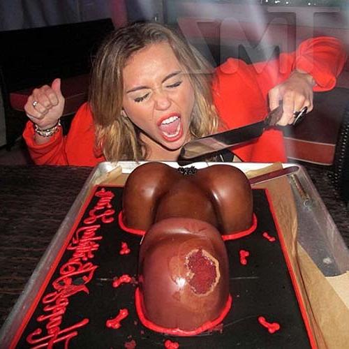 16P Miley Cyrus licking a huge black penis cake at some party