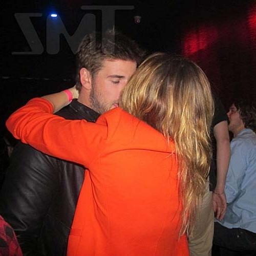 16P Miley Cyrus licking a huge black penis cake at some party