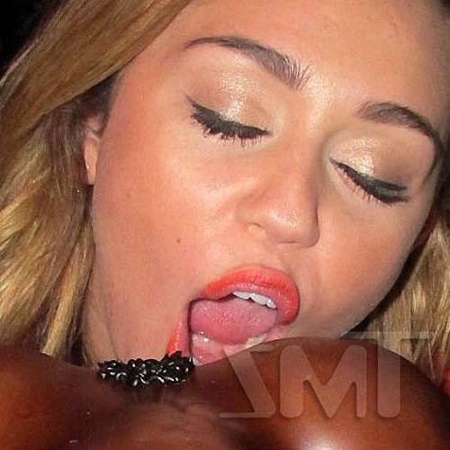 16P Miley Cyrus licking a huge black penis cake at some party