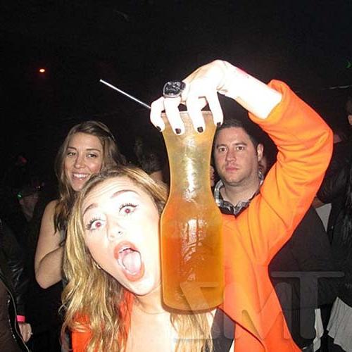 16P Miley Cyrus licking a huge black penis cake at some party